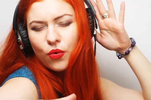 A close-up shot of a young woman in a recording studio, wearing headphones and singing passionately into a microphone. Soft lighting highlights her focused expression as she records a demo for the YG Entertainment audition.