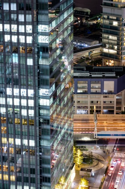 A modern commercial building in a bustling business district in Seoul, South Korea. The building features glass windows, sleek lines, and is surrounded by other high-rise buildings.