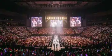 Energetic K-Pop concert in a US arena with cheering fans