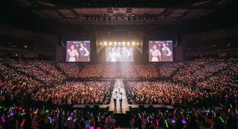 Energetic K-Pop concert in a US arena with cheering fans