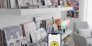 Navigating K-Pop Merchandise: Avoiding Scams in the US Market 2026 Diverse K-Pop merchandise collection with a hand pointing to a scam warning on a phone.