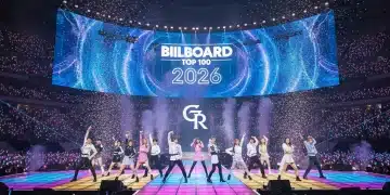 K-Pop group performing on stage with Billboard Top 100 2026 graphic, energized crowd.